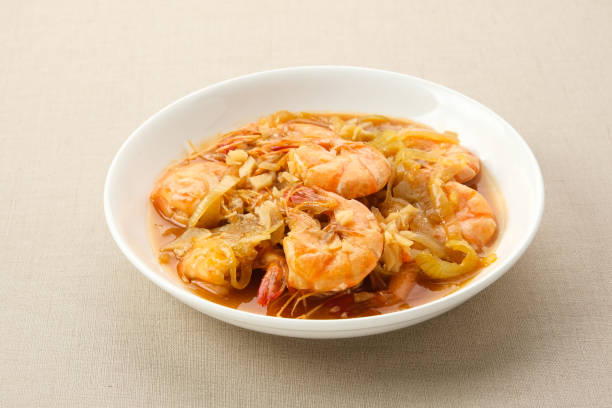 Udang Asam Manis, sweet and sour shrimp with tomato and chilli sauce. Indonesian food.