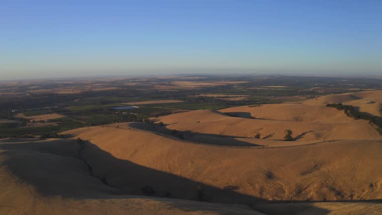 Aerial drone view at sunset of Steingarten lookout in South Australia.
Steingarten lookout, located in the Barossa Valley,  is the perfect spot for a picnic and a well-deserved glass of wine at sunset