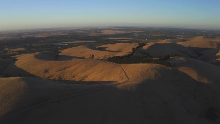 Aerial drone view at sunset of Steingarten lookout in South Australia.
Steingarten lookout, located in the Barossa Valley,  is the perfect spot for a picnic and a well-deserved glass of wine at sunset