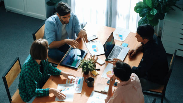istock Top view of businesspeople discuss idea while team joining meeting. Convocation. 2148221027