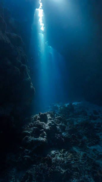 istock The Holy Grail. Rays of sunlight underwater in a cave 2148221629
