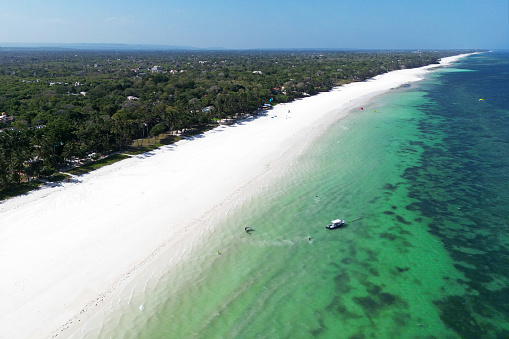 Amazing Diani beach seascape with white sand and turquoise Indian Ocean, Kenya top view,