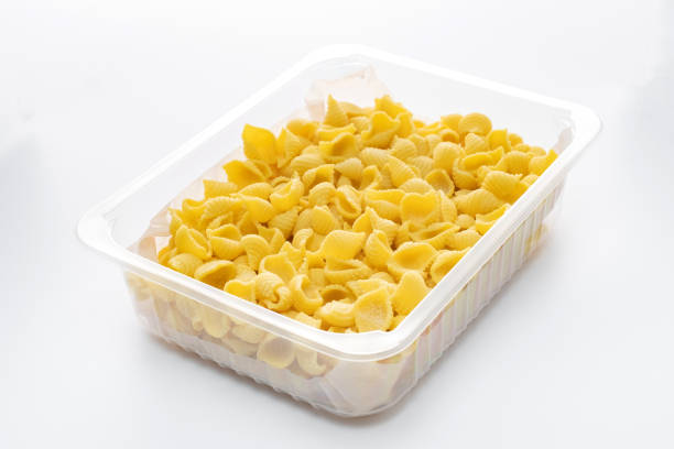 istock Raw conchiglie rigate macaroni in a plastic box isolated on a white background 2148222659
