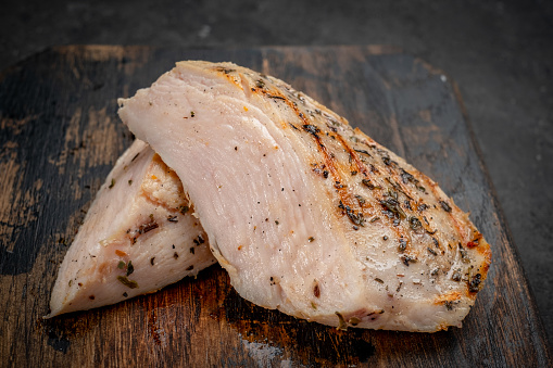 Chicken fillet sous vide grilled and cut on a chopping Board