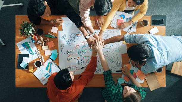 istock Group of business people writing and making mind map at meeting. Convocation. 2148222880