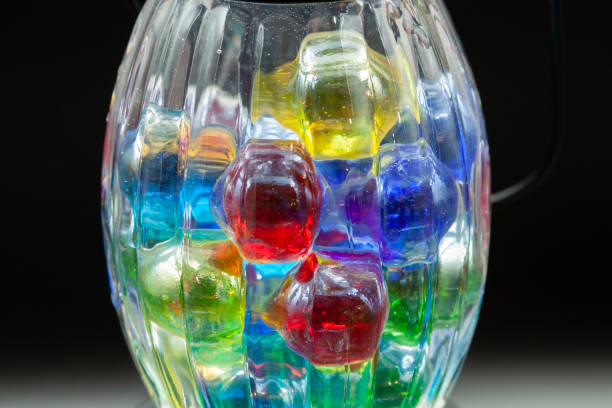 istock Colorful glass balls on black background 2148224075