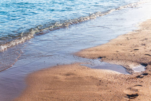 istock Soft wave of the sea on the sandy beach. 2148225230