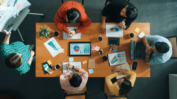istock Top view of business people sharing idea about startup project. Convocation. 2148225676