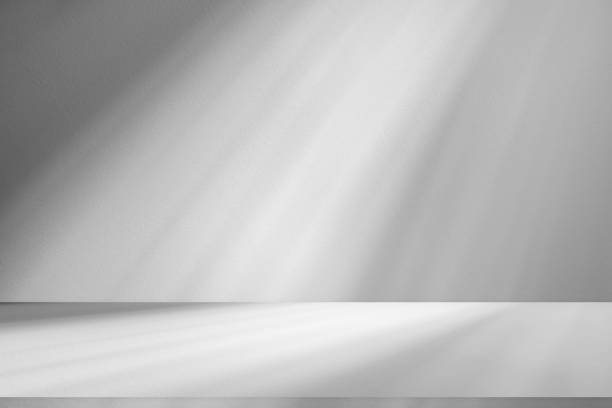 istock Wall interior background, studio and backdrops show products.with shadow from window color white . background for text insertion and presentation product 2148227398