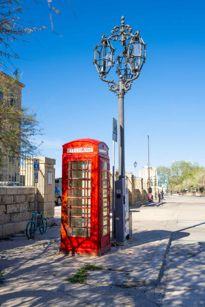 Valletta, Malta, April 03, 2024.  an old telephone booth in the city center
