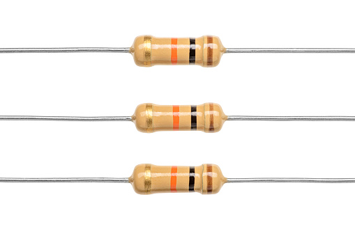 Carbon film resistors isolated on white background. Macro shot of electronic components.