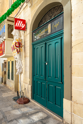 Valletta, Malta, April 03, 2024. the Illy caffè brand sign outside a bar in the city centre