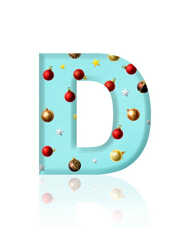 Close-up of three-dimensional Christmas ornament alphabet letter D on white background.