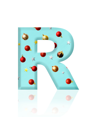 Close-up of three-dimensional Christmas ornament alphabet letter R on white background.
