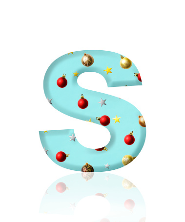 Close-up of three-dimensional Christmas ornament alphabet letter S on white background.