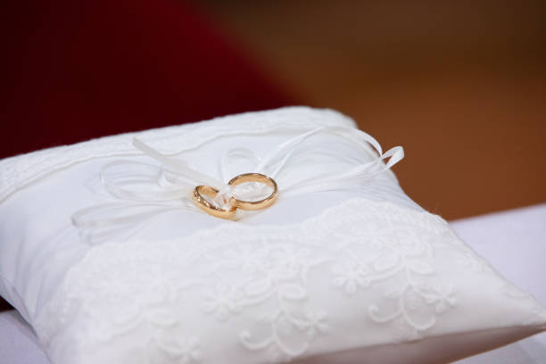 two white gold wedding rings in a red festive and elegant box