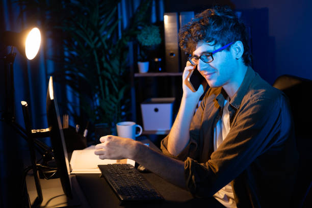 istock Young businessman calling on phone to customer or coworker. Gusher. 2148231489