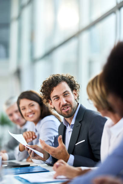 istock Happy entrepreneurs talking about reports on a meeting. 2148232402