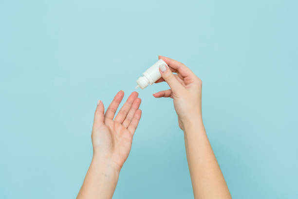 istock Bottle of eye drops (nasal spray) in woman's hand. Copy space 2148232917