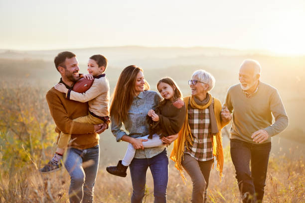 istock Happy multi-generation family taking a walk on the field. 2148233131