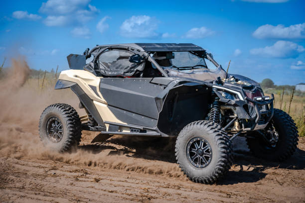 ATV and UTV riding in a sandy dusty track. Amateur competitions. 4x4.