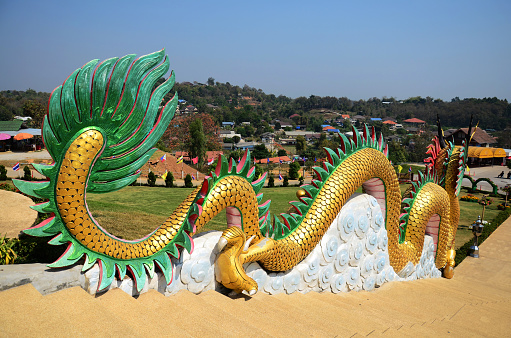 Sculpture chinese dragon statue for thai people travelers entrance travel visit stupa chedi and china pagoda in Wat Huay Pla Kang temple  at Chiangrai city on February 24, 2015 in Chiang Rai, Thailand