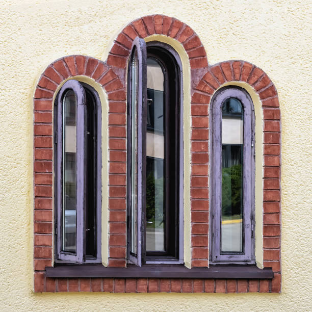 istock wooden window with three arches in the wall 2148234323