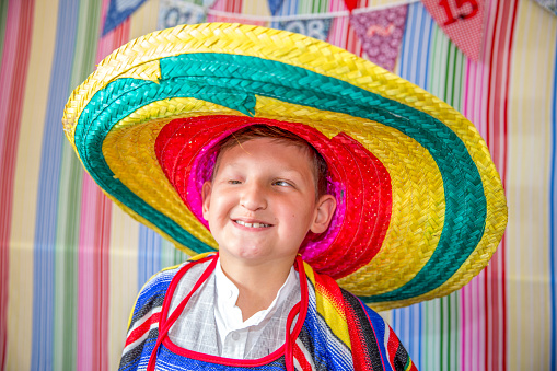 Partially blind disabled boy in sombrero