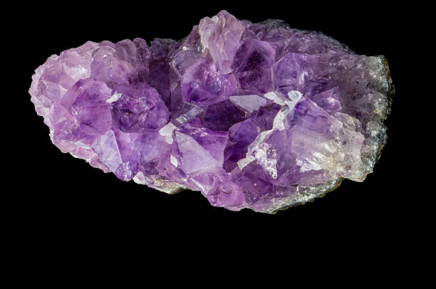 istock Raw amethyst Brazilian rock isolated on black background 2148234763
