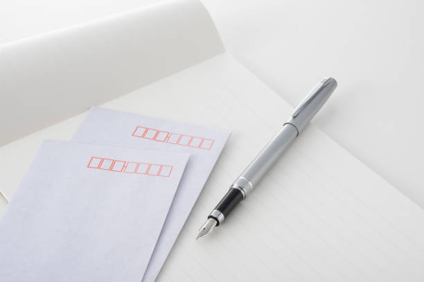 Image of postal service with fountain pen, envelope and letterhead wi