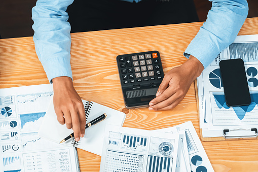 Corporate budget, executive utilize cutting-edge business intelligence financial data dashboard paper on meeting table. Accountant or auditor team examine and calculate income and expense. Habiliment