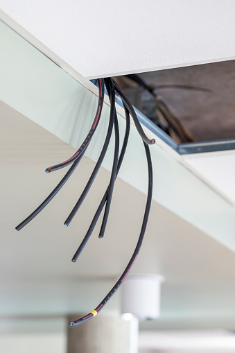 Ceiling installation of electrical cable to power lighting fixtures