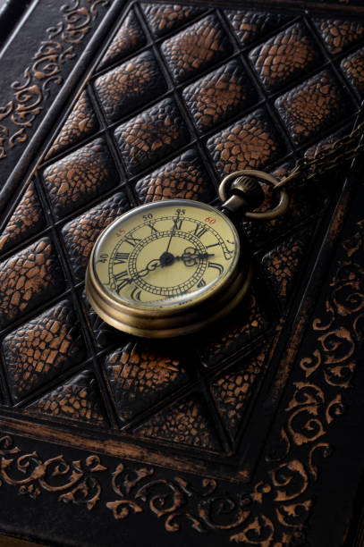 istock pocket watches and old books 2148236582