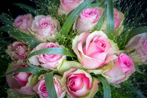 High Angle View Of Rose Bouquet On Bed
