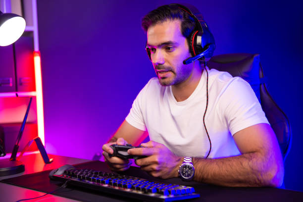 istock Streamer talking with team member players with joystick control game. Surmise. 2148237805