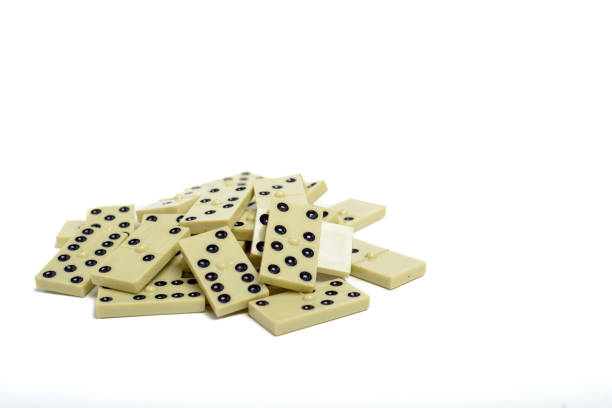 Dominoes game pieces stacked on a white background.