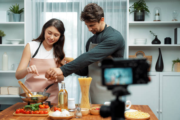 istock Chef influencers cooking special spaghetti with tongs to fried pan. Postulate. 2148238214