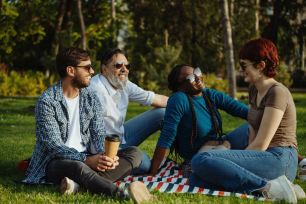 istock Group of diverse friends outdoors on picnic 2148239902