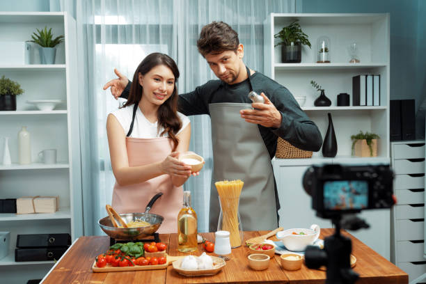 istock Influencers on cooking show presenting ingredient of spaghetti dish. Postulate. 2148240259