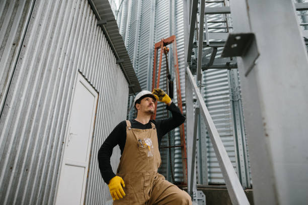 istock An engineer inspects the construction of grain storage silos. 2148240962
