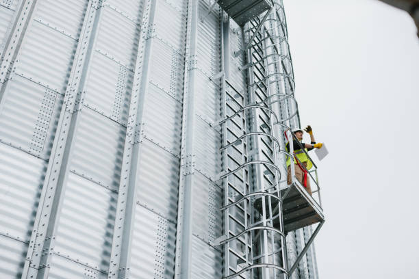 istock A male industrial worker stands on a grain silo with documents in his hands and makes a visual inspection. 2148241021