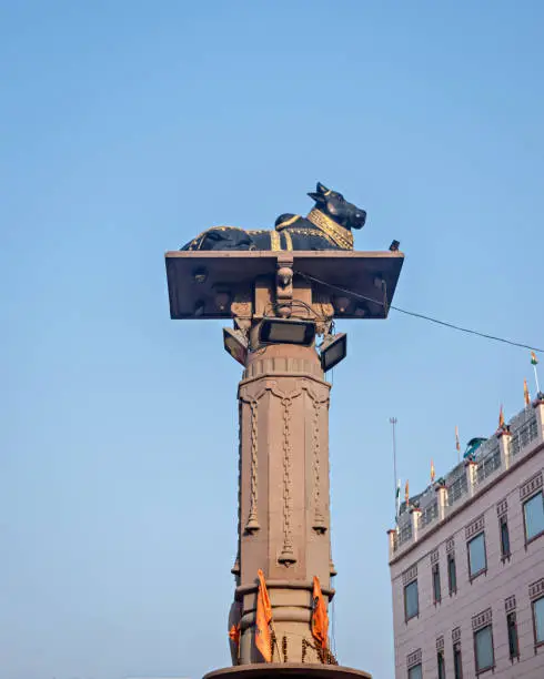 Photo of Godowlia crossing in Varanasi is a famous place having a statue of black Nandi on a pillar.