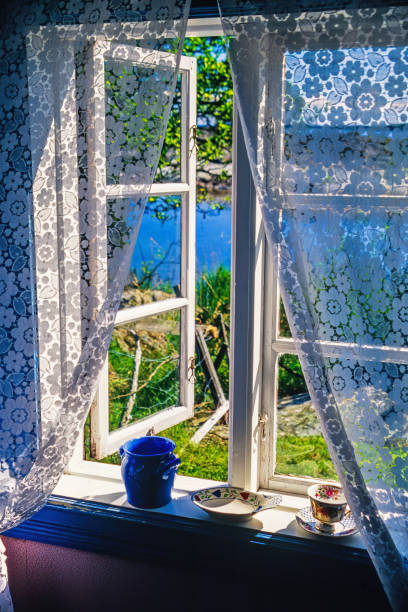 istock Open window in a cottage with a lake view 2148241593