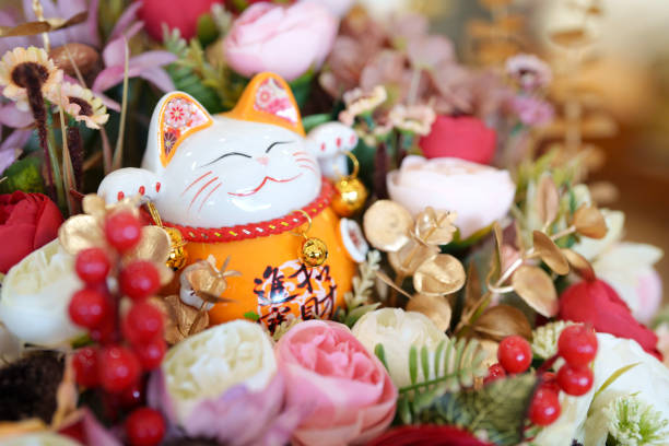 istock Maneki neko cat waving with paw close up 2148241714