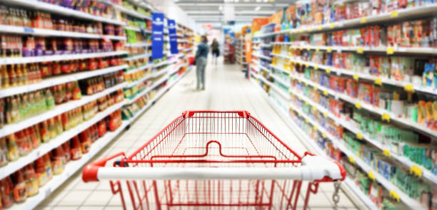 istock Shopping cart, basket in store aisle. 2148242074