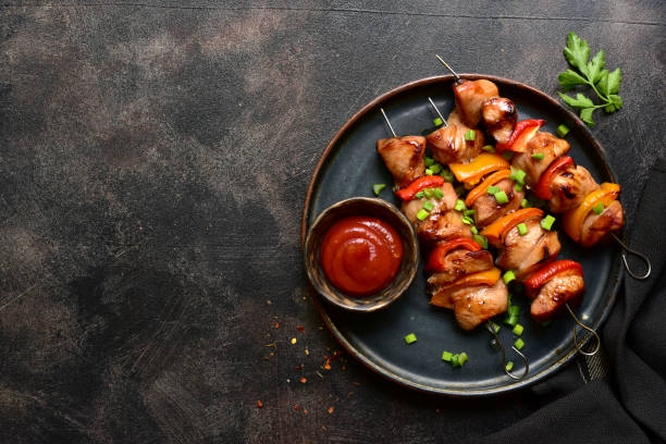 istock Grilled chicken kebab. Top view with copy space. 2148242158