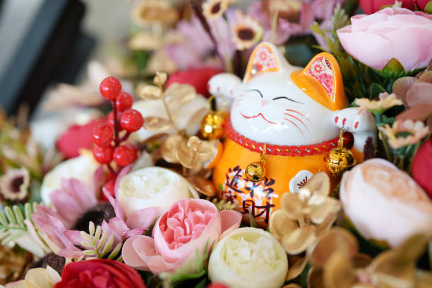 istock Maneki neko cat waving with paw close up 2148242274