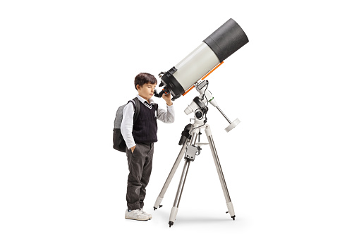 Schoolboy observing the planets and stars with a telescope isolated on white background