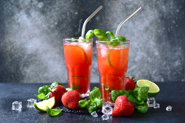 istock Cold summer strawberry cocktail with lime and basil in a  glasses . 2148242647