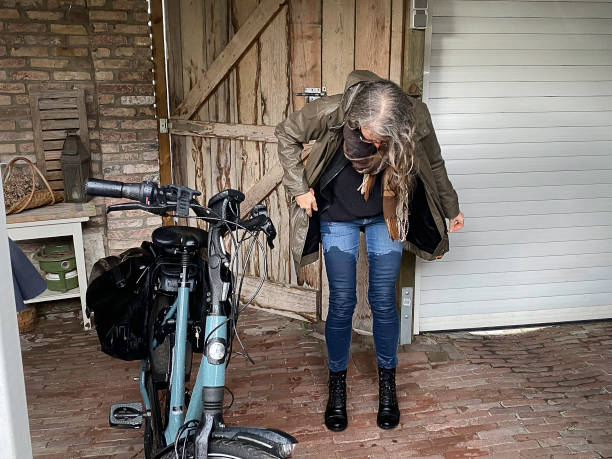 Woman extremly wet after a trip on her e bike